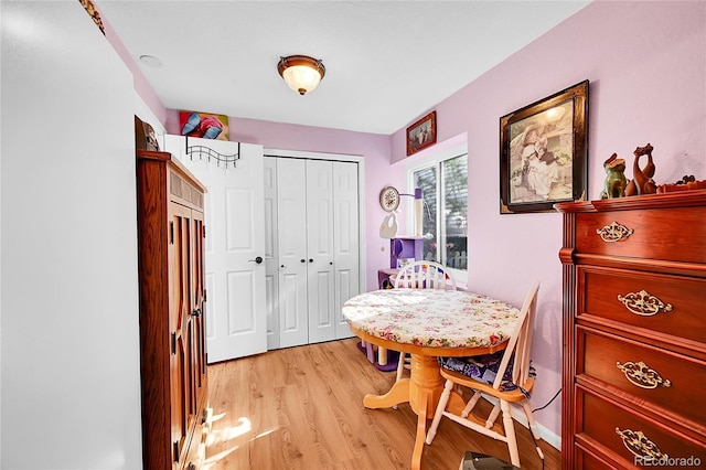 dining area featuring light wood finished floors