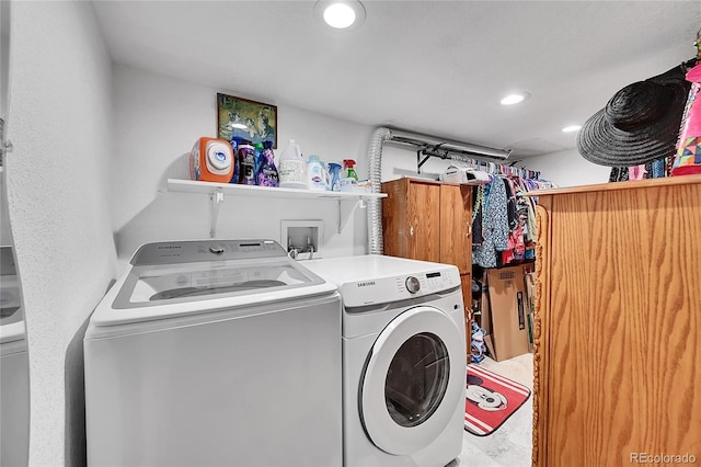 clothes washing area with separate washer and dryer and recessed lighting