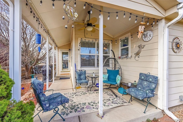 view of patio / terrace featuring ceiling fan and fence