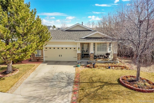 view of front of house with an attached garage, stone siding, concrete driveway, and a front yard