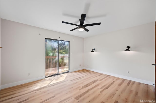 unfurnished room featuring light wood finished floors, baseboards, and a ceiling fan