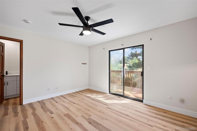 empty room featuring light hardwood / wood-style flooring and ceiling fan