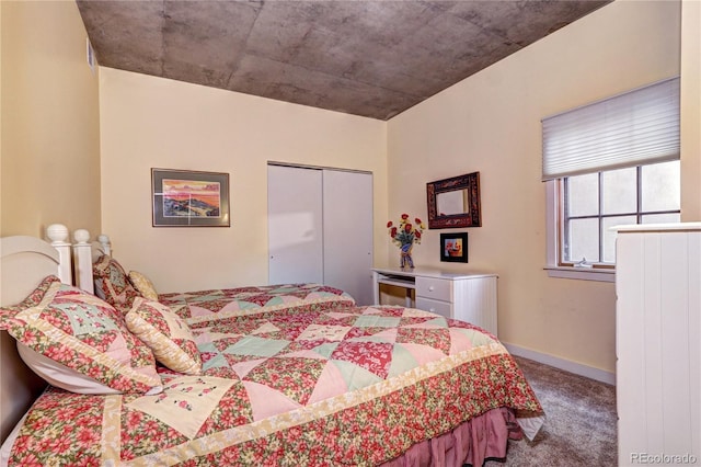 bedroom with carpet and a closet