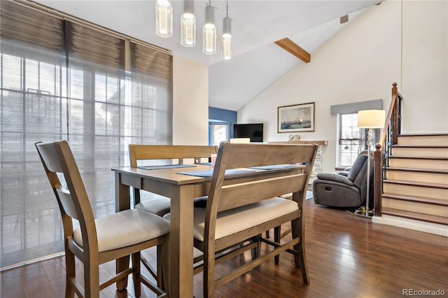 dining area with dark wood-type flooring, high vaulted ceiling, and beamed ceiling