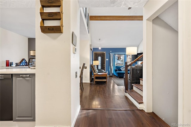 hallway with dark hardwood / wood-style flooring and vaulted ceiling with beams