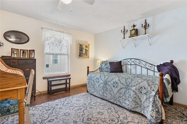 bedroom featuring wood-type flooring and ceiling fan