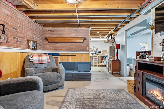 basement featuring brick wall and wood walls