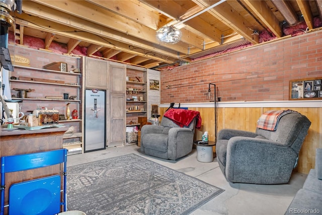 basement featuring brick wall