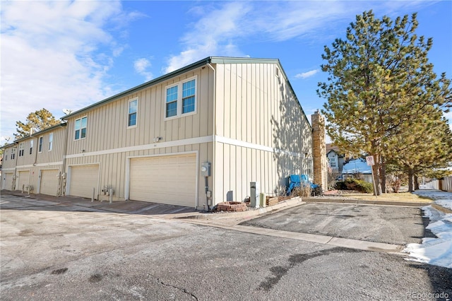 view of side of home with a garage