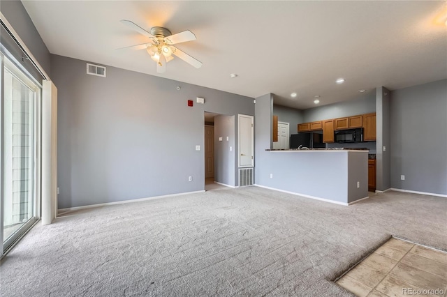 15700 E Jamison Dr Unit 2-204, Englewood, CO 80112 - unfurnished living room featuring ceiling fan and light colored carpet