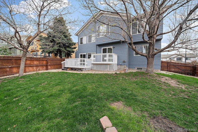 back of house featuring a wooden deck