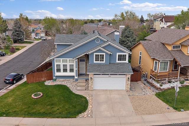 view of front facade featuring a residential view, driveway, an attached garage, stone siding, and a shingled roof