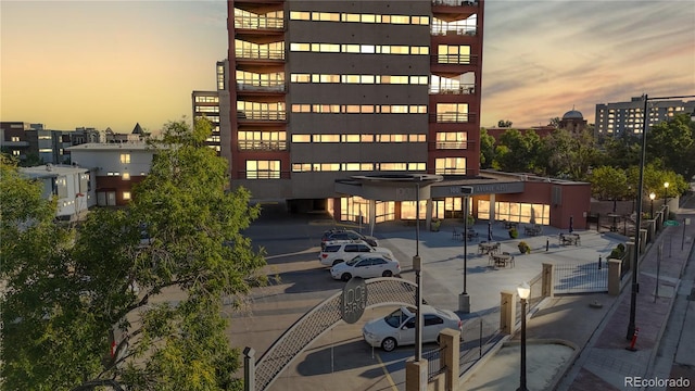 view of outdoor building at dusk