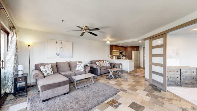 living room featuring ceiling fan