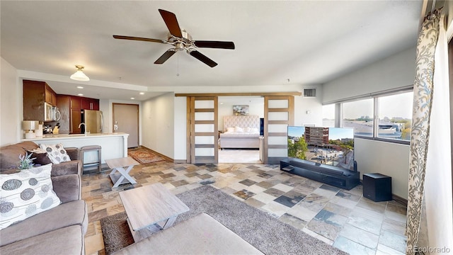 living room featuring ceiling fan