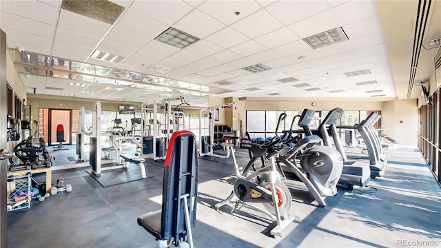 exercise room featuring a paneled ceiling