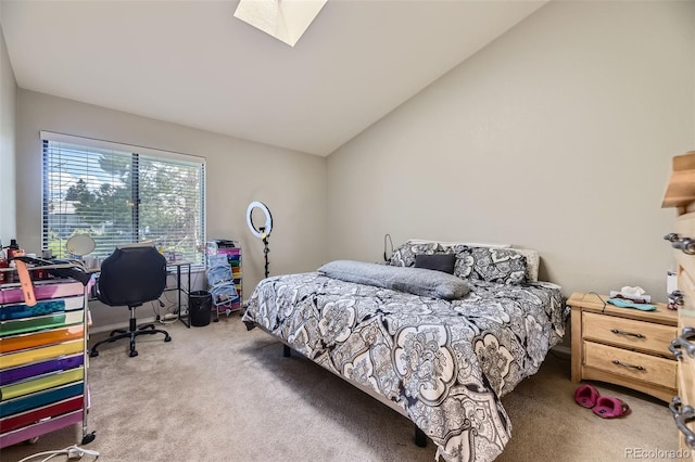 bedroom with carpet flooring and lofted ceiling with skylight