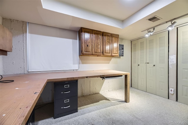 unfurnished office with carpet flooring and visible vents