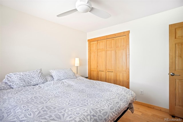 150 Evergreen Rd Unit 204, Dillon, CO 80435 - bedroom featuring light wood finished floors, baseboards, ceiling fan, and a closet