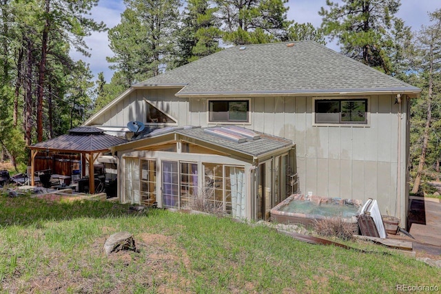 8795 Rudd Rd, Evergreen, CO 80439 - rear view of house with a gazebo, a sunroom, and roof with shingles