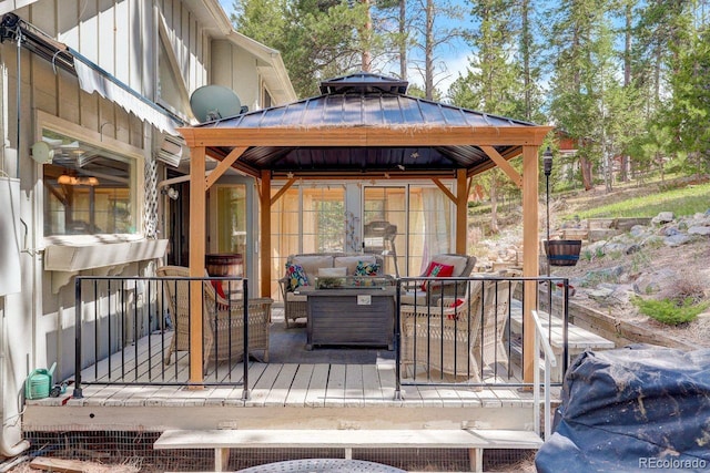 8795 Rudd Rd, Evergreen, CO 80439 - deck featuring a gazebo and an outdoor living space