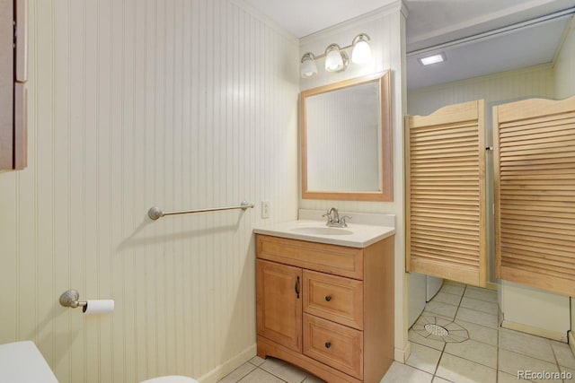 8795 Rudd Rd, Evergreen, CO 80439 - bathroom with tile patterned flooring, vanity, and toilet