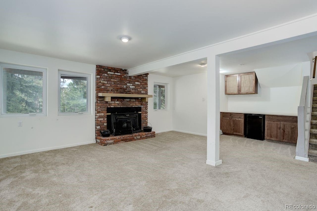 8795 Rudd Rd, Evergreen, CO 80439 - unfurnished living room with light carpet, plenty of natural light, and baseboards