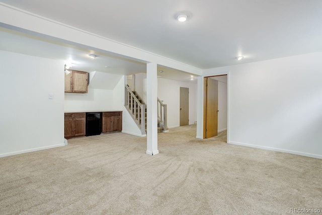 8795 Rudd Rd, Evergreen, CO 80439 - finished below grade area with stairway, light carpet, and baseboards