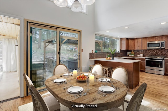 8795 Rudd Rd, Evergreen, CO 80439 - dining space with light wood-style flooring