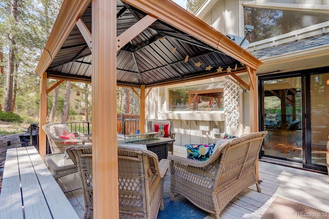 8795 Rudd Rd, Evergreen, CO 80439 - wooden deck featuring a gazebo and outdoor lounge area