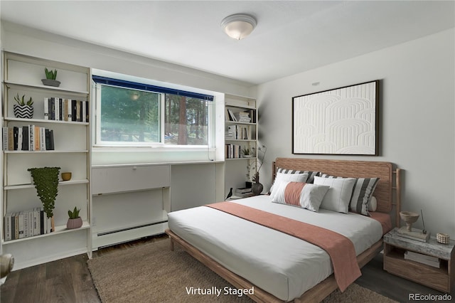 8795 Rudd Rd, Evergreen, CO 80439 - bedroom with a baseboard radiator and wood finished floors