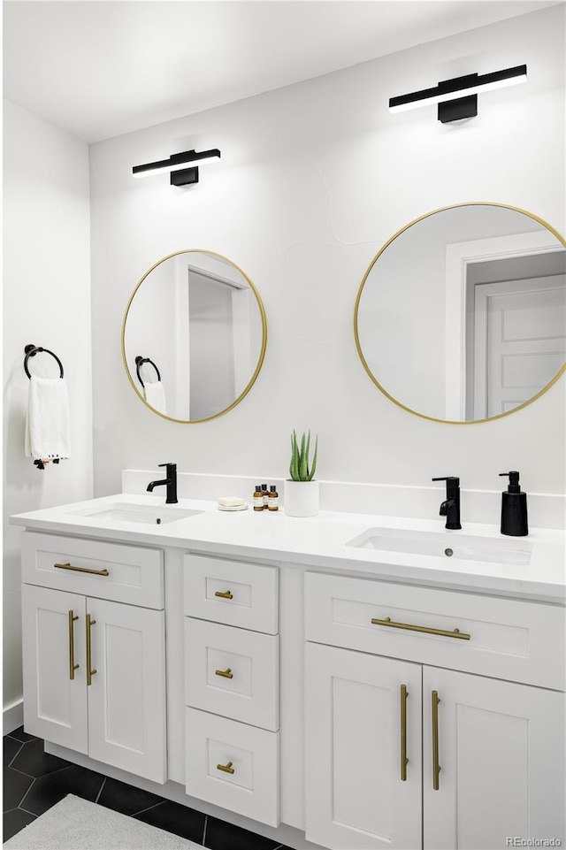 bathroom with tile patterned floors and vanity