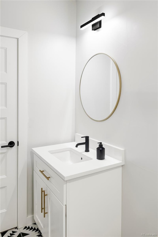 bathroom with vanity and tile patterned flooring