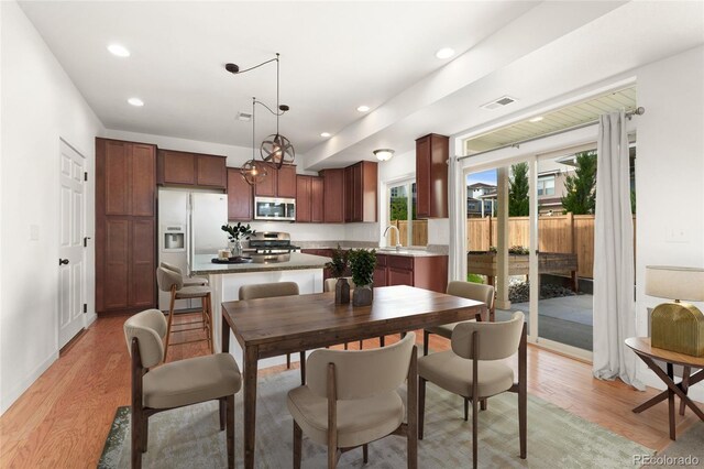 3692 Celestial Ave, Castle Rock, CO 80109 - dining room featuring light wood-style floors and recessed lighting