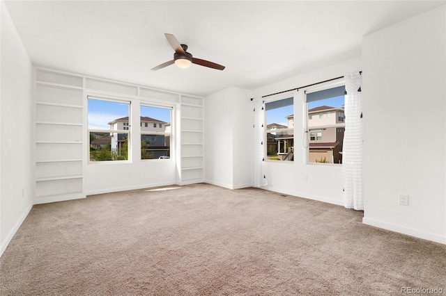 3692 Celestial Ave, Castle Rock, CO 80109 - carpeted spare room featuring ceiling fan, built in features, and baseboards