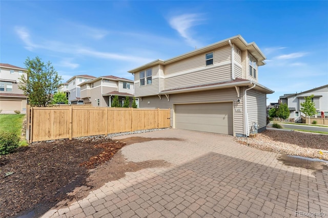3692 Celestial Ave, Castle Rock, CO 80109 - view of front of property with an attached garage, a residential view, and decorative driveway