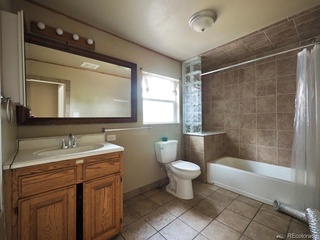 full bathroom featuring shower / tub combo with curtain, tile patterned floors, vanity, and toilet