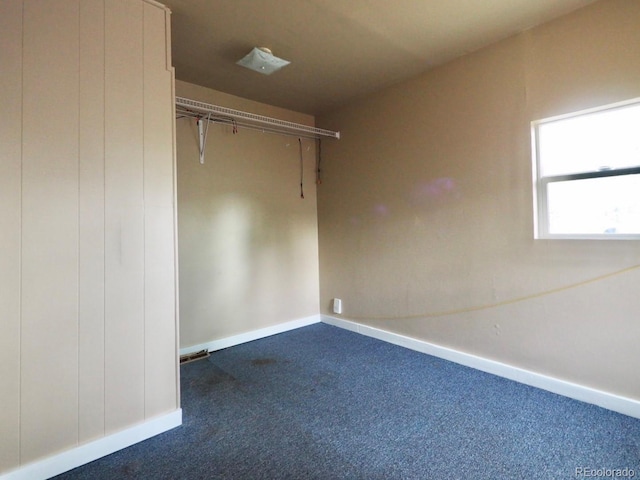 interior space featuring dark colored carpet