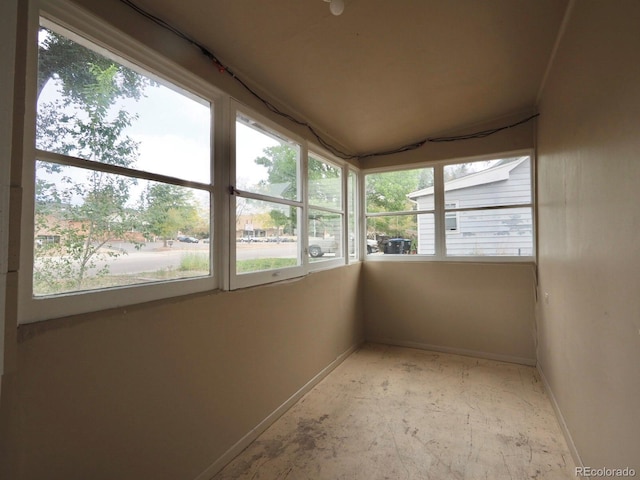 unfurnished sunroom with a wealth of natural light