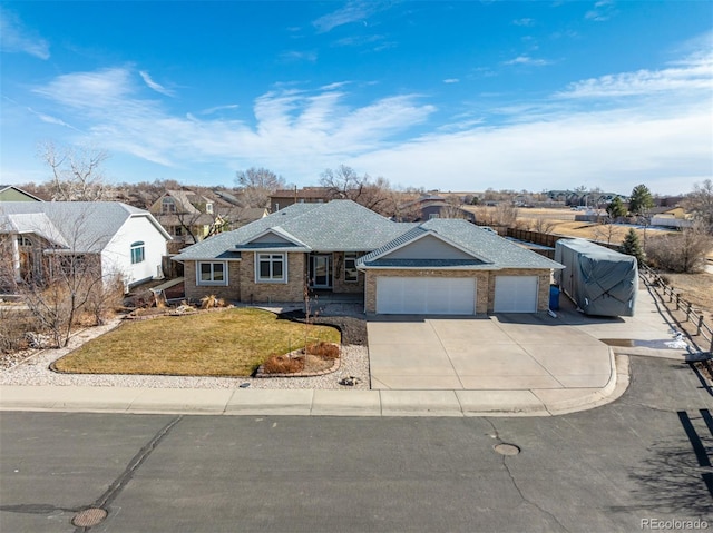 ranch-style house with a garage and a front yard