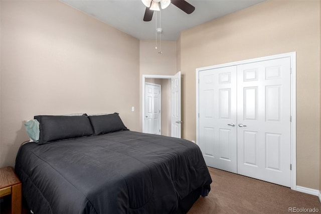 bedroom with carpet floors, ceiling fan, and a closet