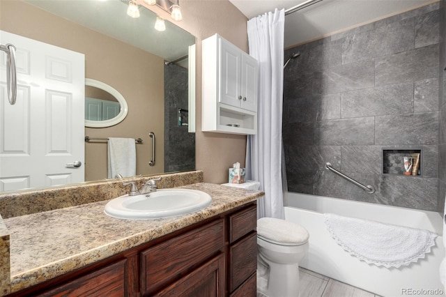 full bathroom featuring a large fireplace, vanity, toilet, and shower / bath combo