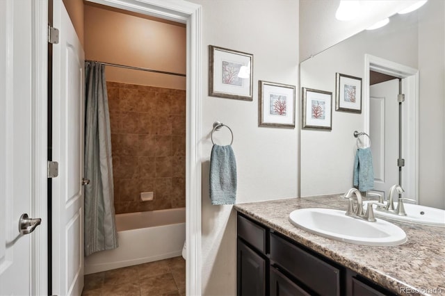 full bath featuring shower / bath combo with shower curtain, vanity, and tile patterned flooring