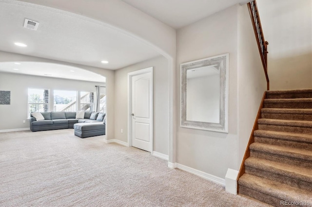 interior space featuring recessed lighting, visible vents, baseboards, and carpet flooring