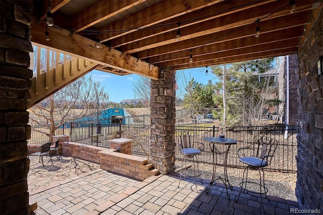 view of patio with fence