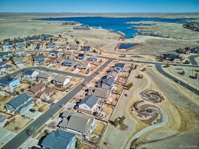 aerial view with a residential view and a water view