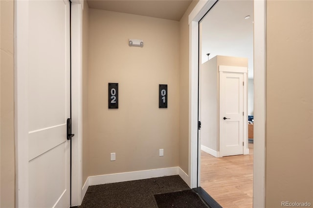 corridor featuring light hardwood / wood-style floors