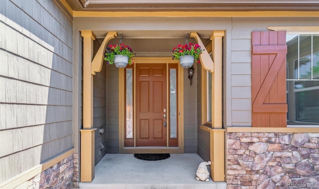25402 E Glasgow Pl, Aurora, CO 80016 - doorway to property featuring stone siding