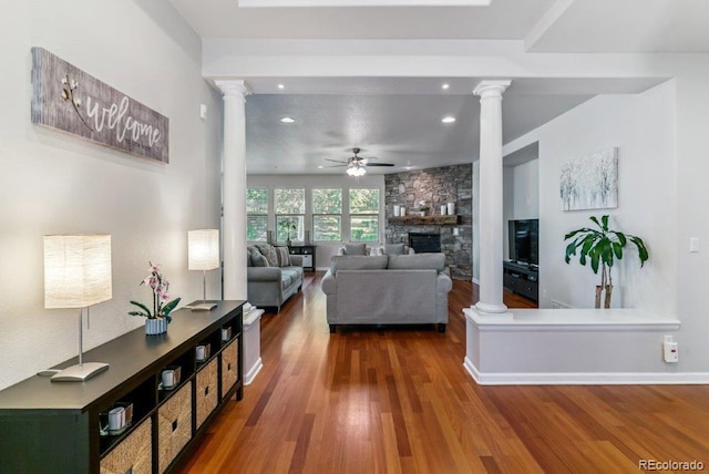 25402 E Glasgow Pl, Aurora, CO 80016 - living room with ornate columns, a ceiling fan, wood finished floors, recessed lighting, and a fireplace