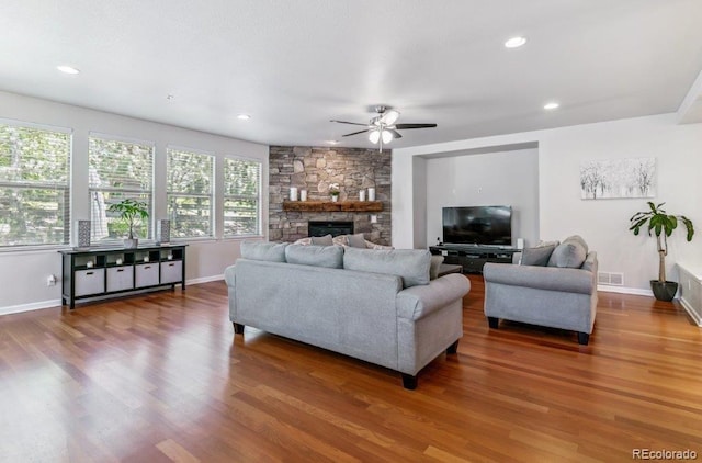 25402 E Glasgow Pl, Aurora, CO 80016 - living area featuring ceiling fan, wood finished floors, a stone fireplace, and recessed lighting